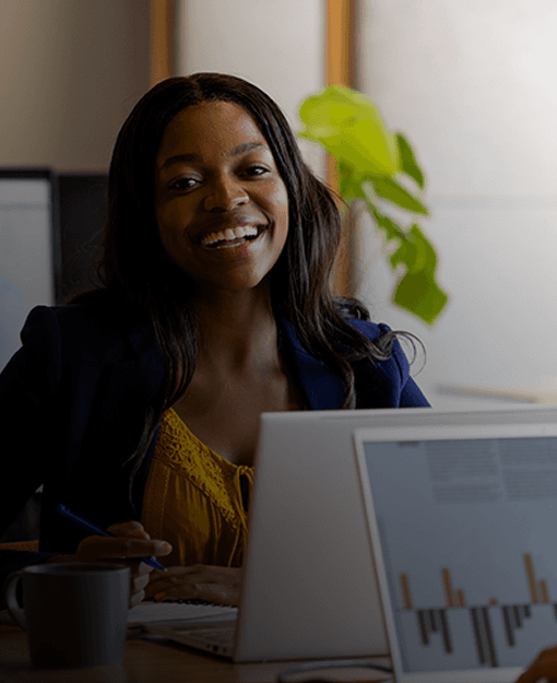 Professional smiling at her laptop - Business Broadband